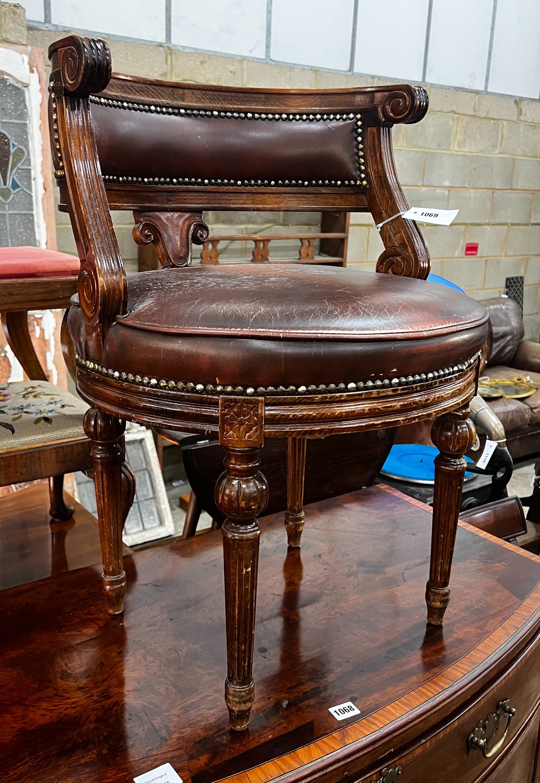 A Continental beech desk chair with leather seat, width 53cm, depth 48cm, height 73cm